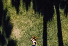나만의 웰니스, 일상에서 실천하는 건강한 삶의 문화 woman lying on green grass during daytime